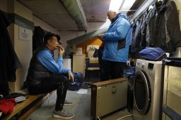 Doswell talks to Sutton's assistant manager Micky Stephens in the coaches' dressing room underneath the main stand.