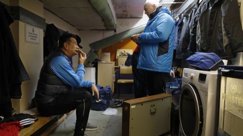 Doswell talks to Sutton's assistant manager Micky Stephens in the coaches' dressing room underneath the main stand.
