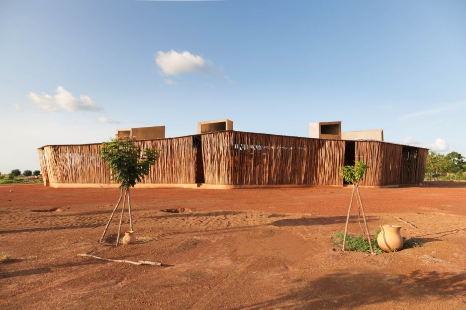 Wrapping around the Lycée Schorge to offer natural shading is a system of screens cut from  fast-growing wood. "It can be 40 degrees in the summer [in Burkina Faso] which lasts eight months," says Kéré.<br /><br />Desert conditions within rural Burkina Faso is taken into account within the architect's daring design with young trees planted as "a barrier against the Sahara winds."