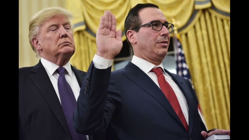 President Trump watches as Steven Mnuchin is sworn in as treasury secretary on Monday, February 13. <a href="index.php?page=&url=http%3A%2F%2Fwww.cnn.com%2F2017%2F02%2F13%2Fpolitics%2Fsteven-mnuchin-senate-confirmation-vote-david-shulkin%2F" target="_blank">The Senate vote was 53-47,</a> mostly along party lines. Mnuchin is a former Goldman Sachs executive.