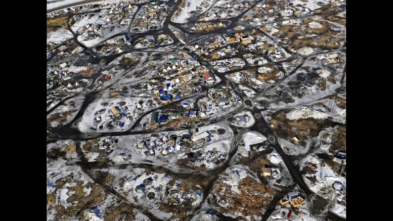 This aerial photo, taken Monday, February 13, shows the Oceti Sakowin camp where people have gathered <a href="index.php?page=&url=http%3A%2F%2Fwww.cnn.com%2F2016%2F09%2F09%2Fus%2Fgallery%2Fnorth-dakota-oil-pipeline%2Findex.html" target="_blank">to protest the Dakota Access Pipeline</a> in Cannon Ball, North Dakota. The pipeline is a $3.7 billion project that would cross four states and change the landscape of the US crude oil supply. The Standing Rock Sioux tribe says the pipeline would affect its drinking-water supply and destroy its sacred sites.