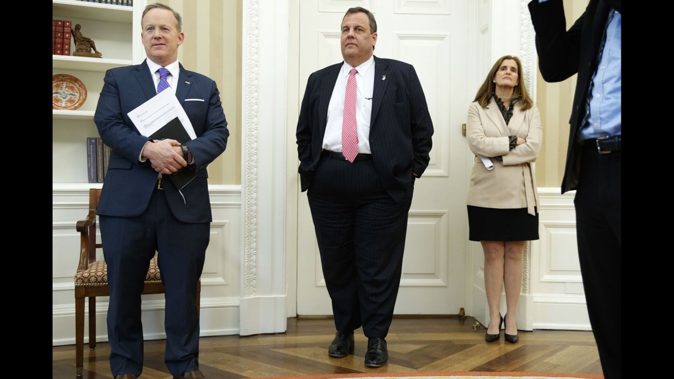 From left, White House press secretary Sean Spicer, New Jersey Gov. Chris Christie and Christie's wife, Mary Pat, watch President Trump sign a piece of legislation in the White House Oval Office on Tuesday, February 14.