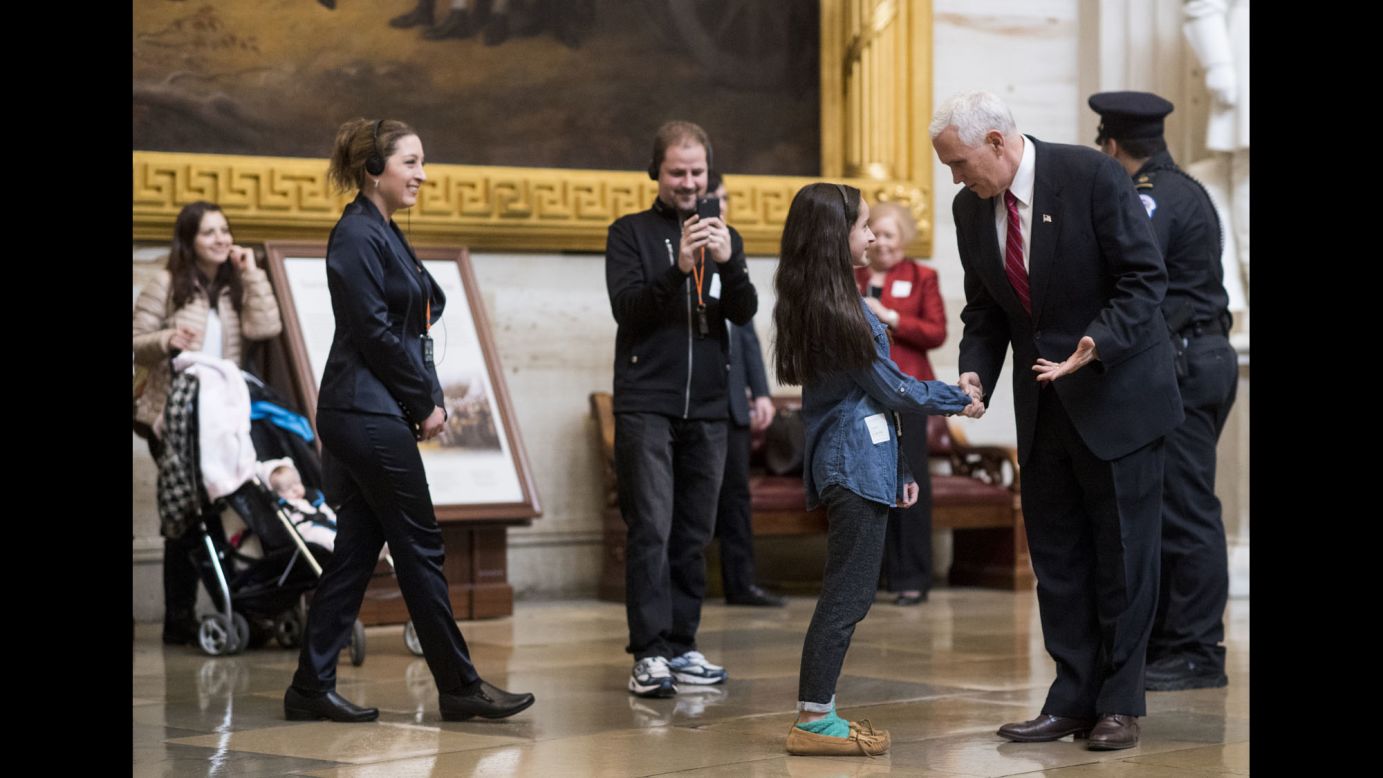 Vice President Mike Pence stops to speak with tourists in the Capitol Rotunda on Tuesday, February 14.