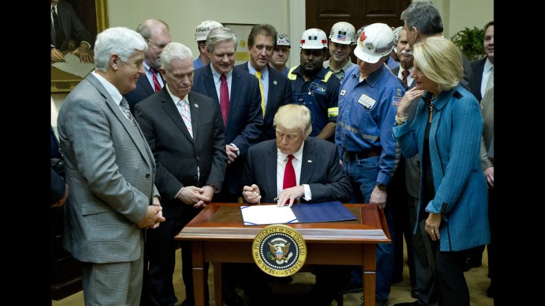President Trump signs legislation Thursday, February 16, that rolls back the "Stream Protection Rule," a last-minute Obama administration rule aimed at stopping the coal-mining industry from dumping waste into nearby waterways. Trump called it a "job-killing rule" as he was joined at the White House by miners as well as legislators from coal-mining states.