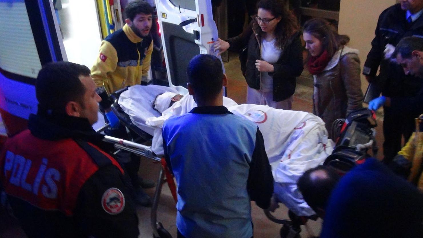 Medical workers load a small child into an ambulance in the town of Viransehir, Turkey.
