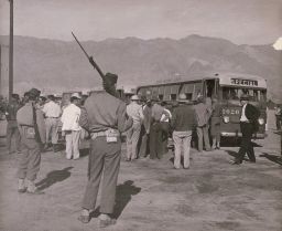 Soldiers stand guard at the Manzanar War Relocation Center in California, circa 1942.