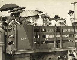 Families aboard a truck are seen at the Jerome Relocation Center in Arkansas on June 18, 1944.