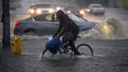 A bicyclist rides along a flooded street as a powerful storm moves across Southern California on February 17, 2017 in Sun Valley, California. After years of severe drought, heavy winter rains have come to the state, and with them, the issuance of flash flood watches in Santa Barbara, Ventura and Los Angeles counties, and the evacuation of hundreds of residents from Duarte, California for fear of flash flooding from areas denuded by a wildfire last year.   