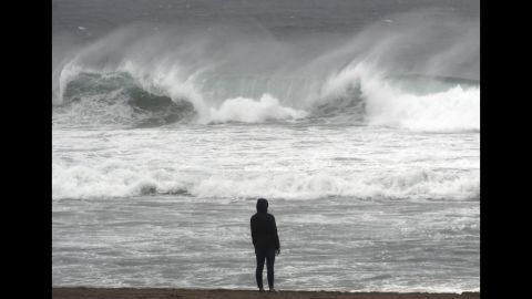 Large waves pound the shore at El Porto in Manhattan Beach as storms slam the Los Angeles area on February 17.
