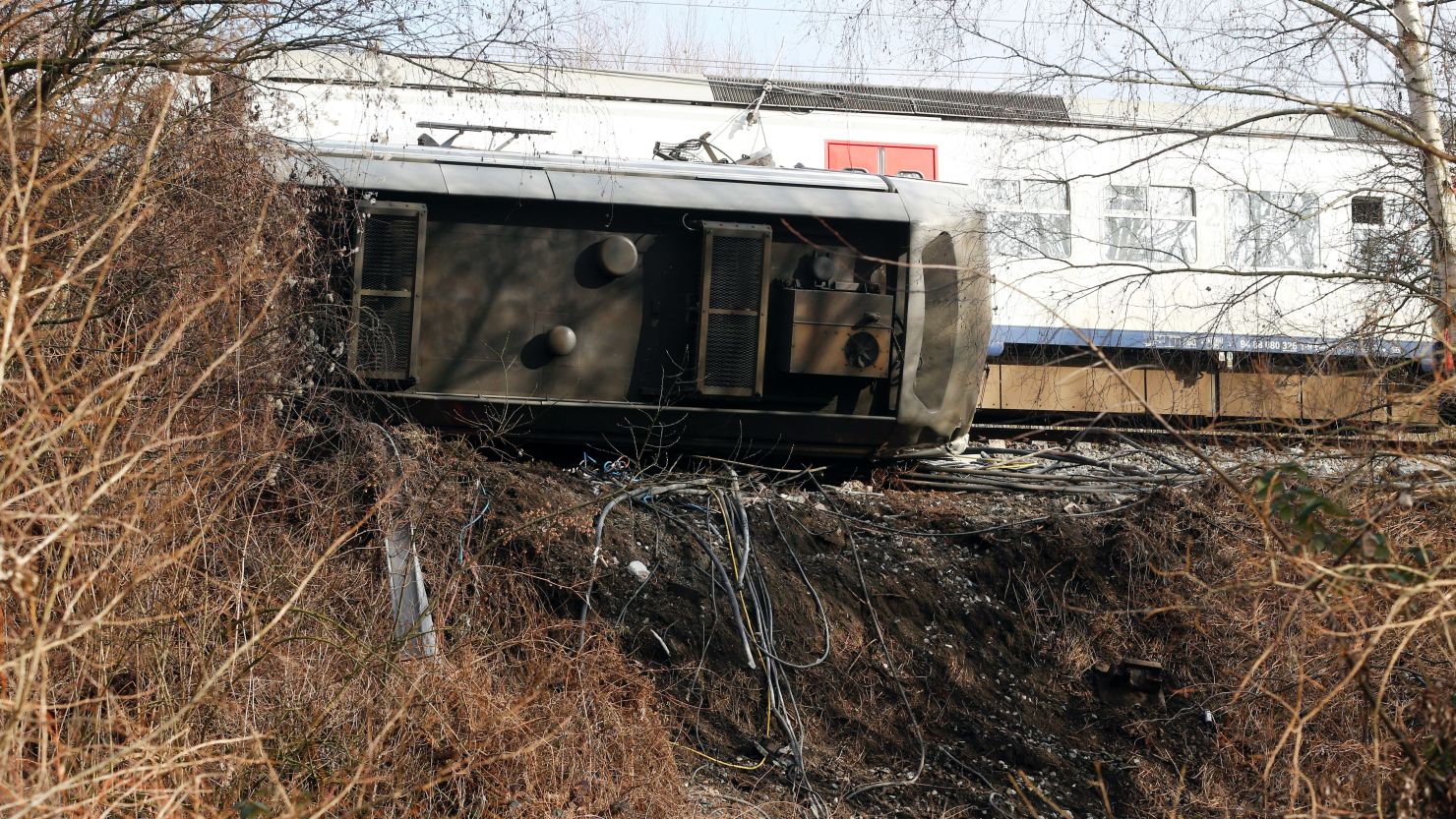 The train derailed shortly after leaving Leuven station Saturday, causing one car to overturn.