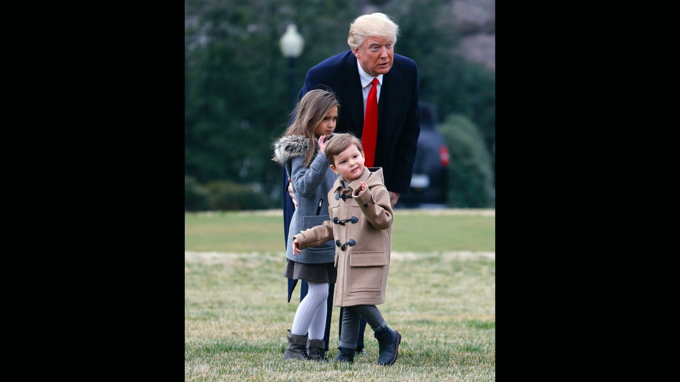 President Donald Trump and his grandchildren, Arabella and Joseph Kushner, walk on the South Lawn of the White House to board Marine One on Friday, February 17.