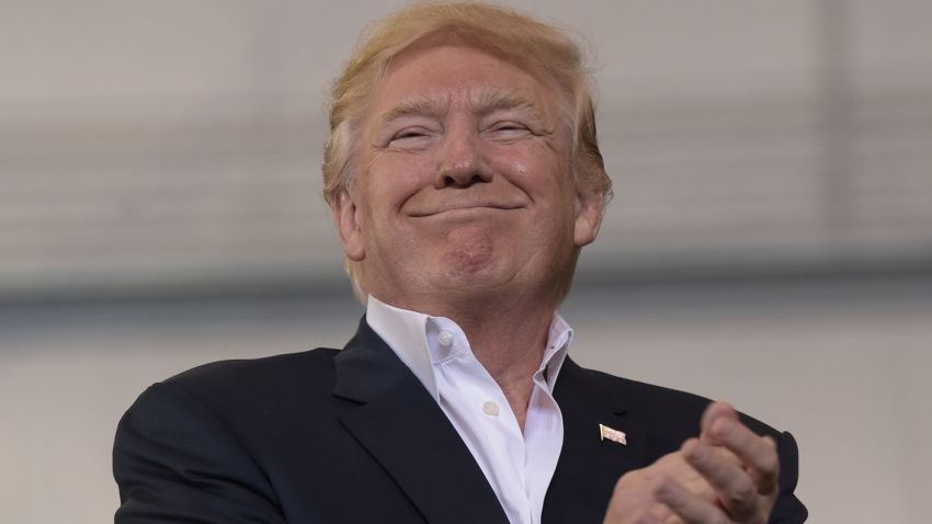 President Donald Trump smiles as he prepares to speak at his "Make America Great Again Rally" at Orlando-Melbourne International Airport in Melbourne, Fla., Saturday, Feb. 18, 2017.  (AP Photo/Susan Walsh)