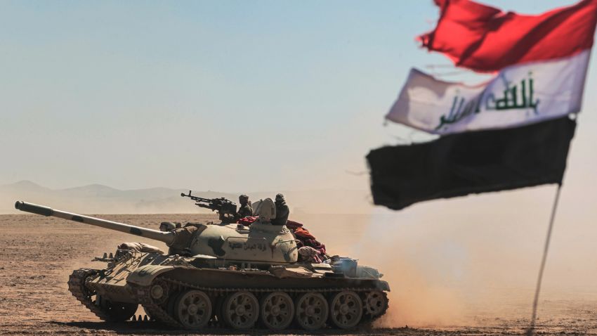 Tanks and armored vehicles of the Iraqi forces, supported by the Hashed al-Shaabi paramilitaries, advance towards the village of Sheikh Younis, south of Mosul, as the offensive to retake the western side of Mosul from Islamic State group fighters commenced on February 19, 2017. 