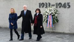 US Vice President Mike Pence, his wife Karen, and daughter Charlotte, walk from the International Memorial of former Nazi concentration camp of Dachau after laying a wreath on February 19. 