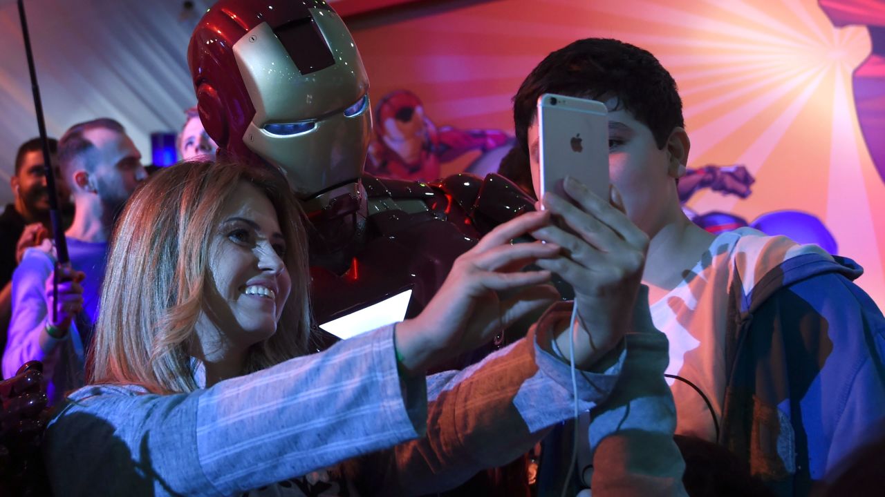 A Lebanese woman poses for a selfie with a man dressed up as "Iron Man" during Saudi Arabia's first ever Comic-Con event in the coastal city of Jeddah on February 16, 2017.