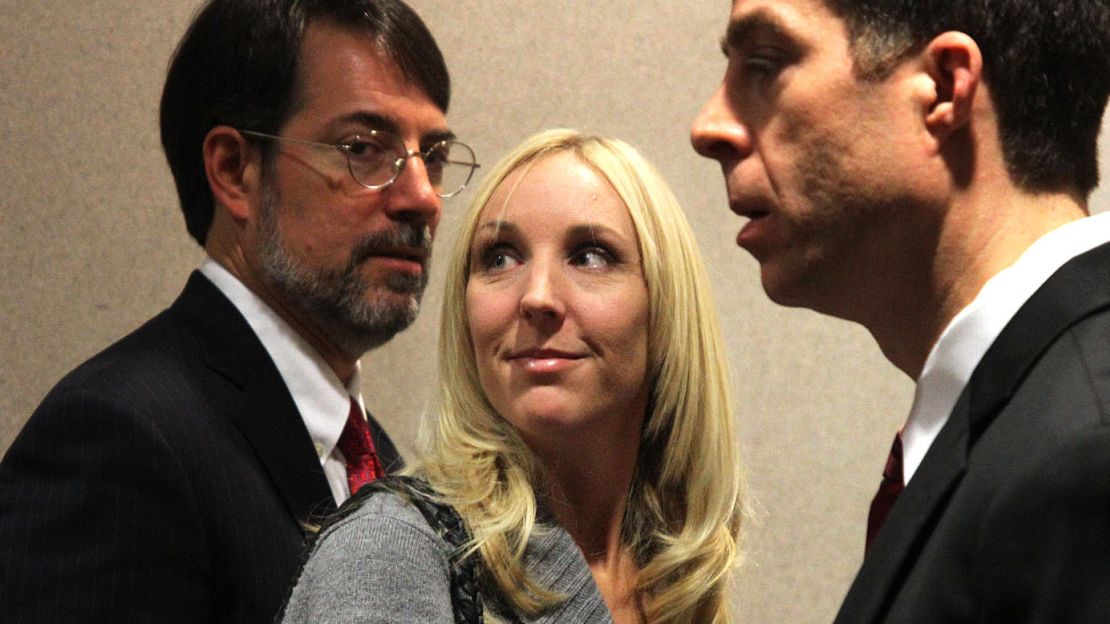 Nicole Oulson and her attorneys Stephen Leal and TJ Grimaldi in a Dade City, Florida court house on January 30, 2014, after a court hearing and appeal for Curtis Reeves, the man accused of fatally shooting and killing her husband Chad Oulson in a movie theatre on January. 13, 2014. 