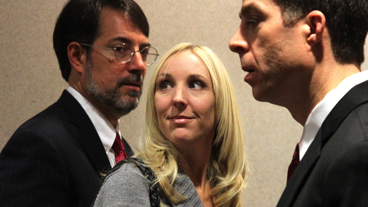 Nicole Oulson and her attorneys Stephen Leal and TJ Grimaldi in a Dade City, Florida court house on January 30, 2014, after a court hearing and appeal for Curtis Reeves, the man accused of fatally shooting and killing her husband Chad Oulson in a movie theatre on January. 13, 2014. 