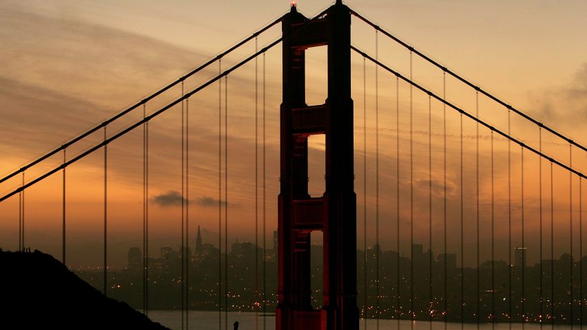 SAN FRANCISCO - JANUARY 27:  The San Francisco skyline is seen behind the north tower of the Golden Gate Bridge January 27, 2005 in San Francisco. A controversial film made by moviemaker Eric Steel documenting people committing suicide off of the Golden Gate Bridge has opened a debate about why there isn't a suicide barrier on the famous landmark. Over 1,300 people have jumped to their death from the span since the bridge opened in 1937. (Photo by Justin Sullivan/Getty Images)