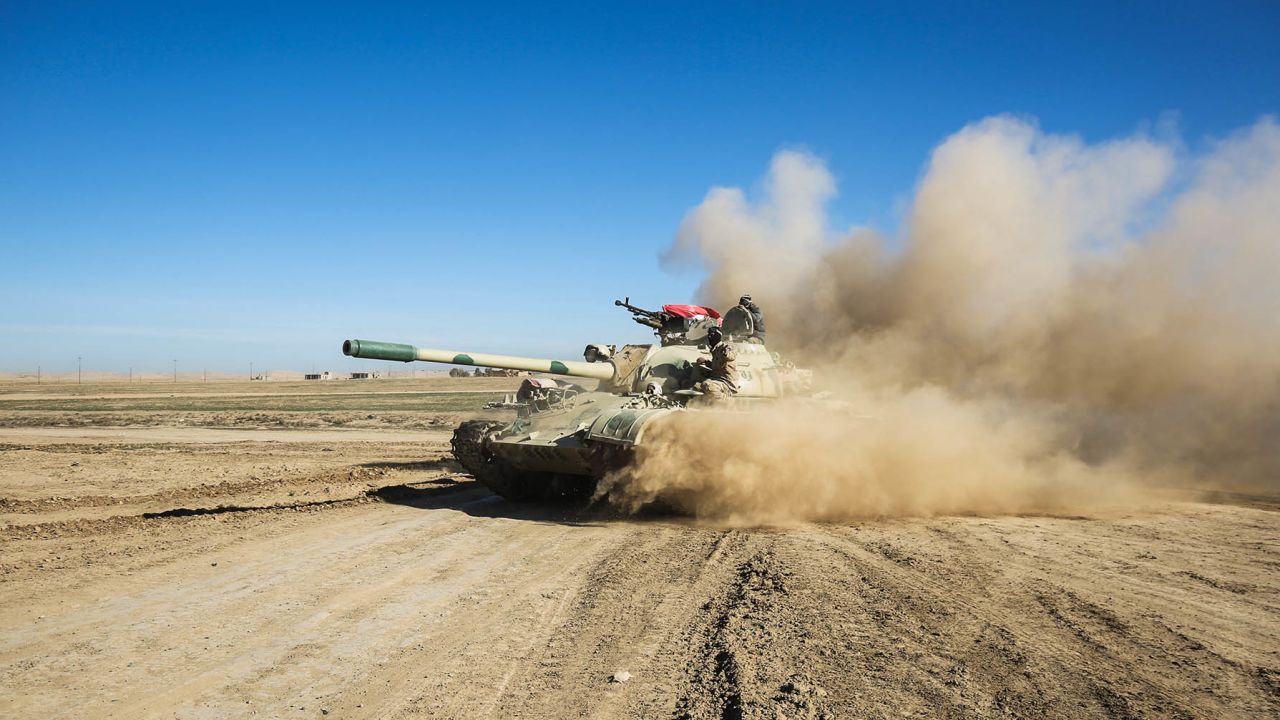 Tanks and armored vehicles of the Iraqi forces, supported by the Hashed al-Shaabi (Popular Mobilisation) paramilitaries, advance towards the village of Sheikh Younis, south of Mosul, after the offensive to retake the western side of Mosul from Islamic State (IS) group fighters commenced on February 19, 2017.