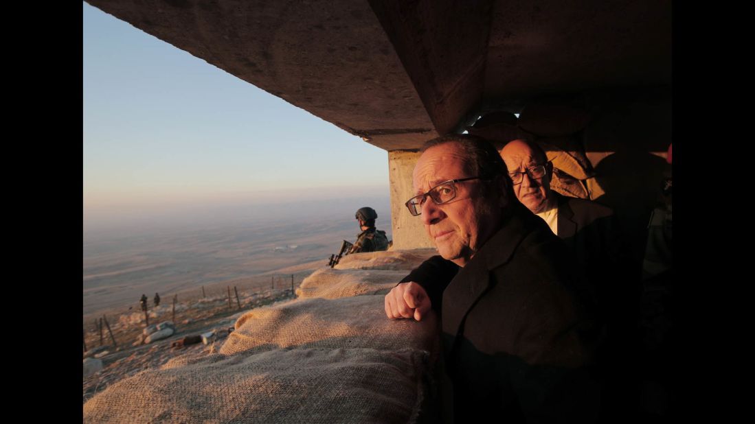 French President Francois Hollande and French Defense Minister Jean-Yves Le Drian, right, view territory held by ISIS during a visit to a military outpost near Mosul on Monday, January 2.