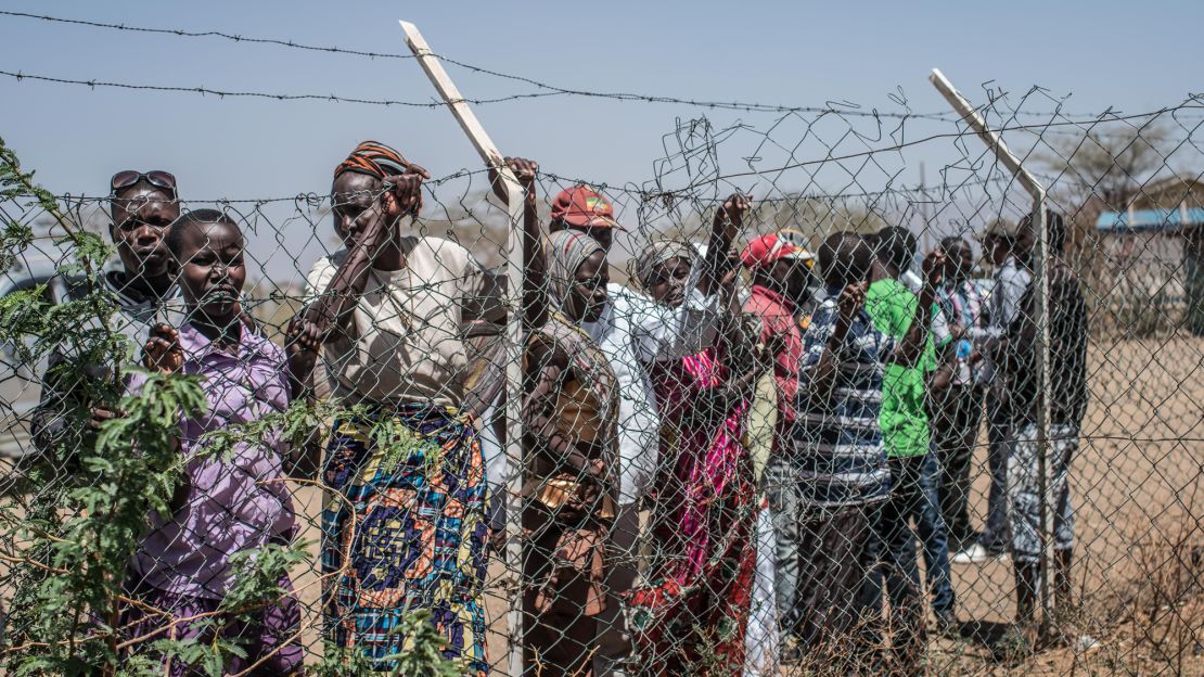 Crowds gather outside the airstrip at Kakuma camp in northwest Kenya, where about 160,000 refugees live.