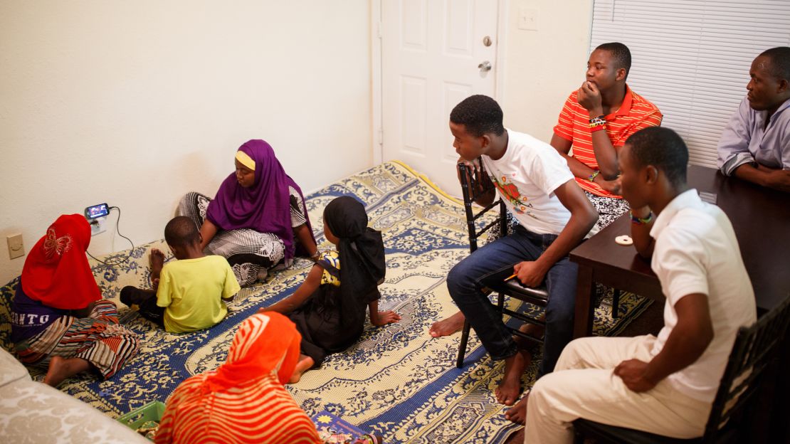 Abdalla and his family don't have a TV, so they relax in their living room by watching videos on a cell phone.