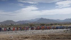 TOPSHOT - The peloton rides during the first stage of the 8th edition of the cycling Tour of Oman between al-Sawadi Beach and Naseem Park on February 14, 2017 in Manumah. 
Norway's Alexander Kristoff from Team Katusha Alpecin won the stage ahead of Italian Kristian Sbaragli (L) from Team Dimension Data who came second and Italian Sonny Colbrelli (R) from Bahrain Merida in third place. / AFP / Eric Feferberg        (Photo credit should read ERIC FEFERBERG/AFP/Getty Images)