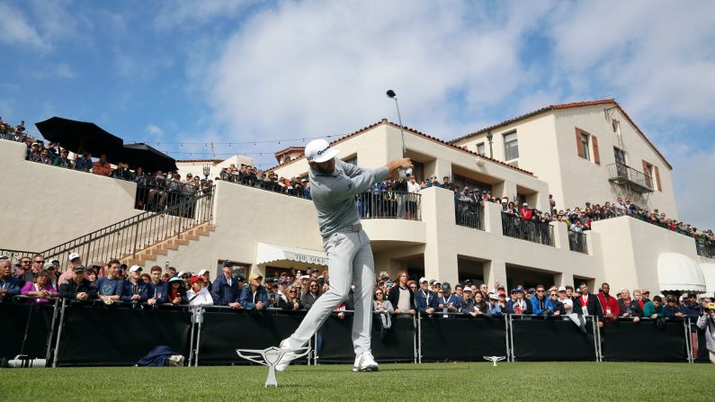 Golf fans watch Dustin Johnson tee off during the final round of the Genesis Open in Los Angeles on Sunday, February 19. Johnson won the tournament by five shots and <a href="index.php?page=&url=http%3A%2F%2Fwww.cnn.com%2F2017%2F02%2F20%2Fgolf%2Fgolf-dustin-johnson-world-number-one%2Findex.html" target="_blank">moved to No. 1</a> in the World Golf Rankings.
