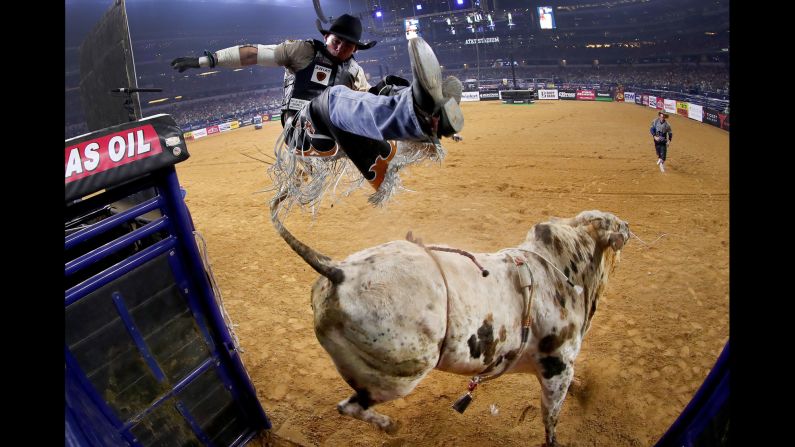 Marco Antonio Eguchi is bucked off Bottoms Up during a Professional Bull Riders event in Arlington, Texas, on Saturday, February 18.
