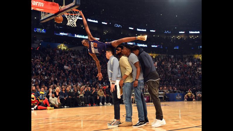 Derrick Jones Jr. tries to dunk over some of his Phoenix Suns teammates during the NBA's Slam Dunk Contest on Saturday, February 18. Jones finished in second behind Glenn Robinson III.