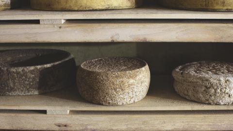 Ana Roš and partner Valter Kramar age rounds of local Tolminc cheese for up to seven years.