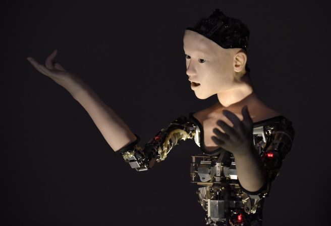 Alter, a new android developed by researchers at Tokyo University and Osaka University, moves its head, eyes, mouth, body and hands in response to the number of people around it. 