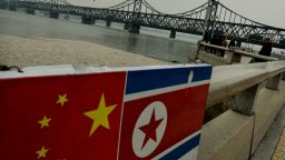 north korea and china flags dandong mark ralston afp getty images