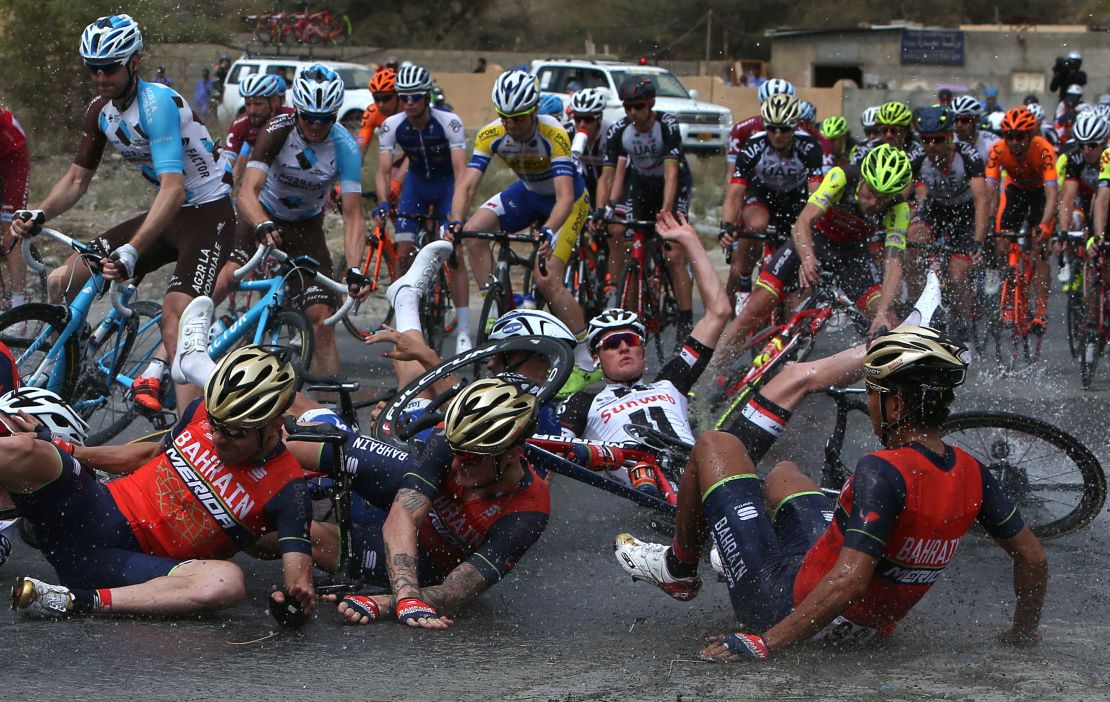 Riders fall to the ground during the Tour of Oman's fifth stage.