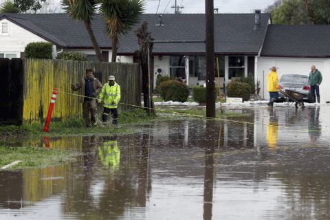 Residents walk down a flooded road in Salinas, California, on Monday, February 20.<a href="http://www.cnn.com/2017/02/20/weather/weather-flooding-storms/index.html" target="_blank"> </a>