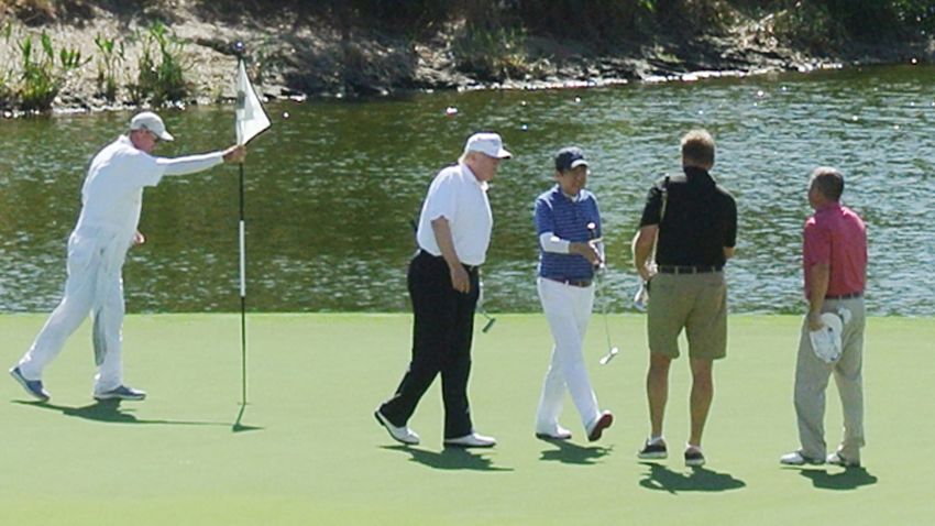 US President Donald Trump and Japan's Prime Minister Shinzo Abe enjoy playing golf in Florida on February 11, 2017.