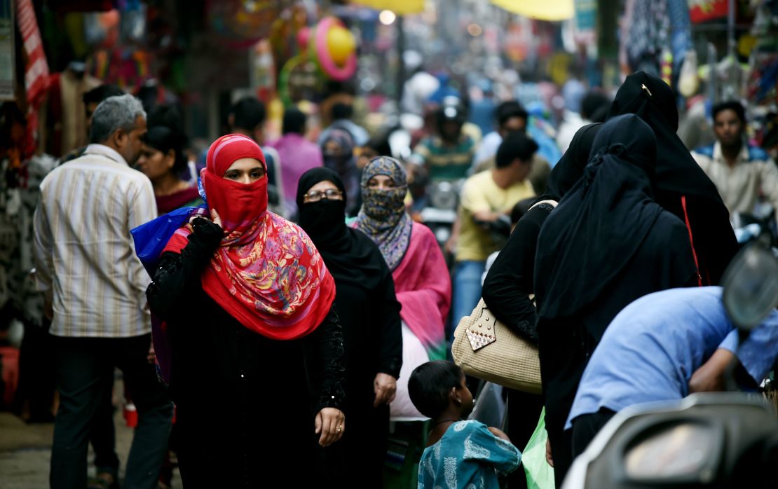 In this photograph taken on April 28, 2016, Muslim shoppers walk through a market in Bhopal.
