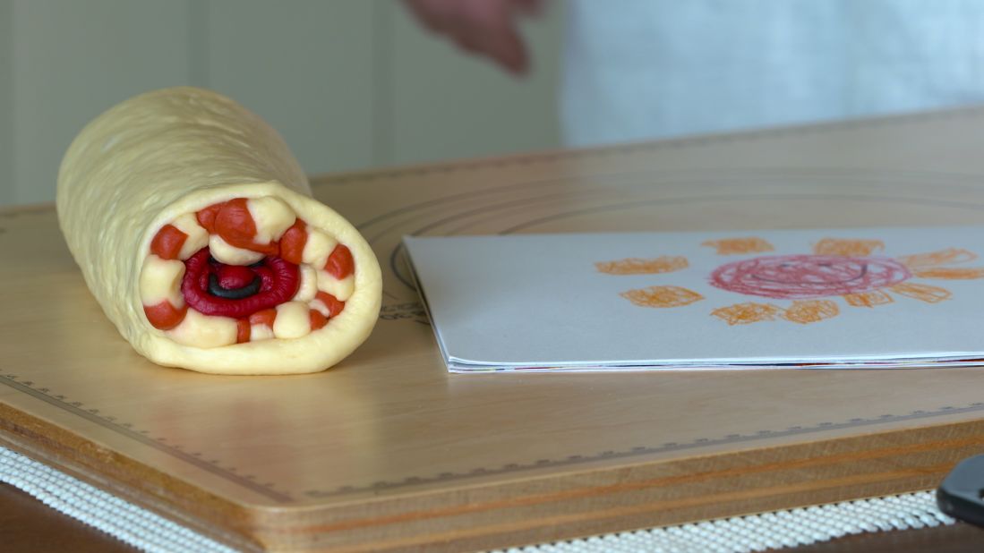 Ran learned how to illustrate bread by experimenting. She piled up colored dough in a way she hoped would imitate a drawing, until she cracked the formula. Now she says she can bake pretty much any original illustration, including her son's doodles. 