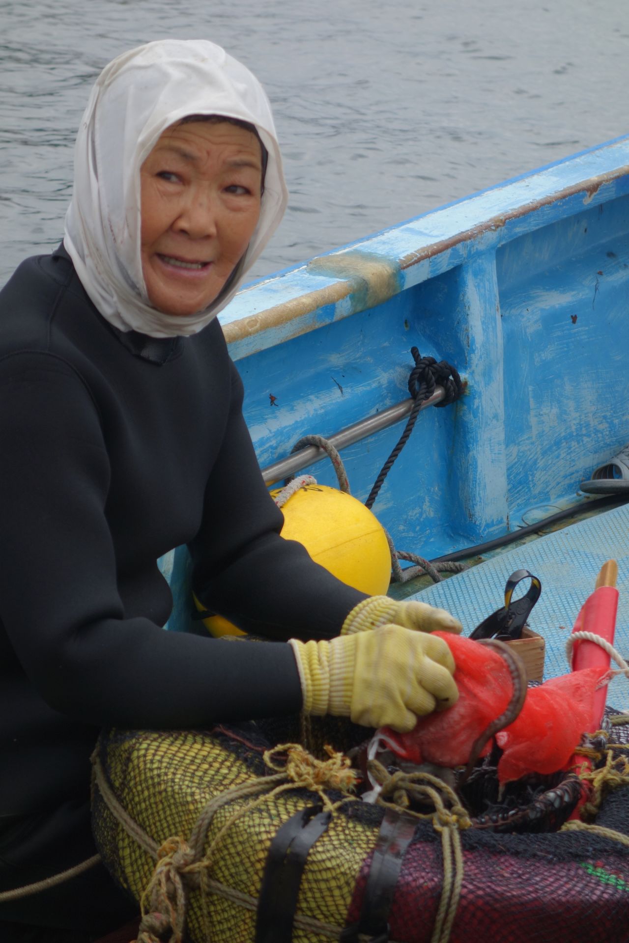 <strong>A dying profession: </strong>Sayuri empties her sukari as the boat heads back to shore. Like her, many ama are in their 60s and have been diving their entire adult lives. 