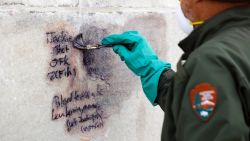 A U.S. Park Service employee works to clean graffiti off of the Washington Monument, Tuesday, February 21 in Washington. 