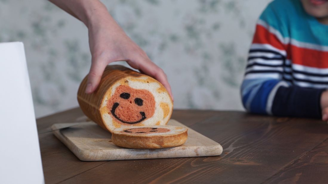 From the outside, her creations look like a regular loaf of bread. But once sliced, cute pictures are revealed.