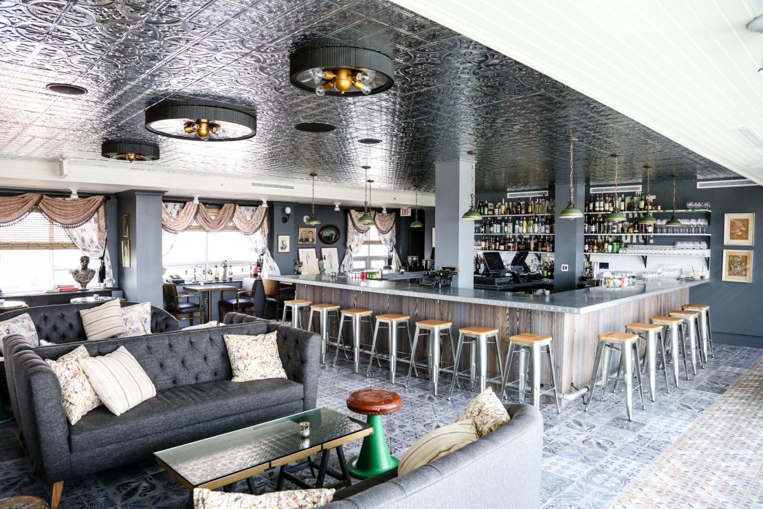 Hot Tin's enclosed main room opens onto rooftop terraces with views of New Orleans.