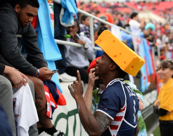 US speedster Carlin Isles, who bagged a try in the 2018 final, is popular with the home supporters. Here he wears a cheese hat at the request of a fan taking his photo after a 2014 game.