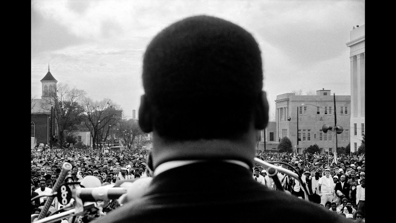 The Rev. Martin Luther King Jr. speaks to protesters in Montgomery, Alabama, on March 25, 1965. About 25,000 people had marched there from Selma, Alabama, to protest discriminatory practices -- such as poll taxes and literacy tests -- that prevented many black people from voting in the South. It was the last of three marches that month.