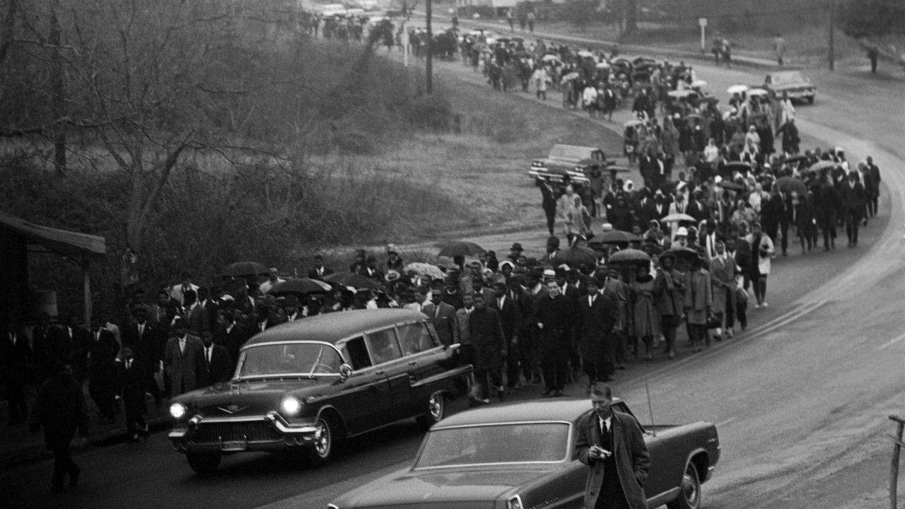 A hearse carries the body of Jimmie Lee Jackson, a black deacon and civil rights activist who was shot by a state trooper during a voting rights march in Marion, Alabama, in February 1965. Jackson's death was a catalyst for the first Selma-Montgomery march.