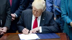WASHINGTON, DC - FEBRUARY 16:  U.S. President Donald Trump signs H.J. Res. 38, disapproving the rule submitted by the US Department of the Interior known as the Stream Protection Rule in the Roosevelt Room of the White House on February 16, 2017 in Washington, DC.  The Department of Interior's Stream Protection Rule, which was signed during the final month of the Obama administration, "addresses the impacts of surface coal mining operations on surface water, groundwater, and the productivity of mining operation sites," according to the Congress.gov summary of the resolution. (Photo by Ron Sachs-Pool/Getty Images)