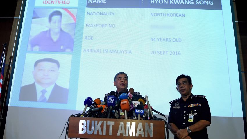 Royal Malaysian Police chief Khalid Abu Bakar (L) addresses journalists in front of a screen displaying the details of North Korean Embassy staff Hyon Kwong Song, who has been identified for questioning, during a press conference at the Bukit Aman police headquarters in Kuala Lumpur on February 22, 2017, following the assassination of Kim Jong-Nam, the half brother of North Korean leader Kim Jong-Un. Malaysian investigators want to question a North Korean diplomat over the assassination of Kim Jong-Un's half-brother in Kuala Lumpur, national police chief Khalid Abu Bakar said February 22.  / AFP / Manan VATSYAYANA        (Photo credit should read MANAN VATSYAYANA/AFP/Getty Images)