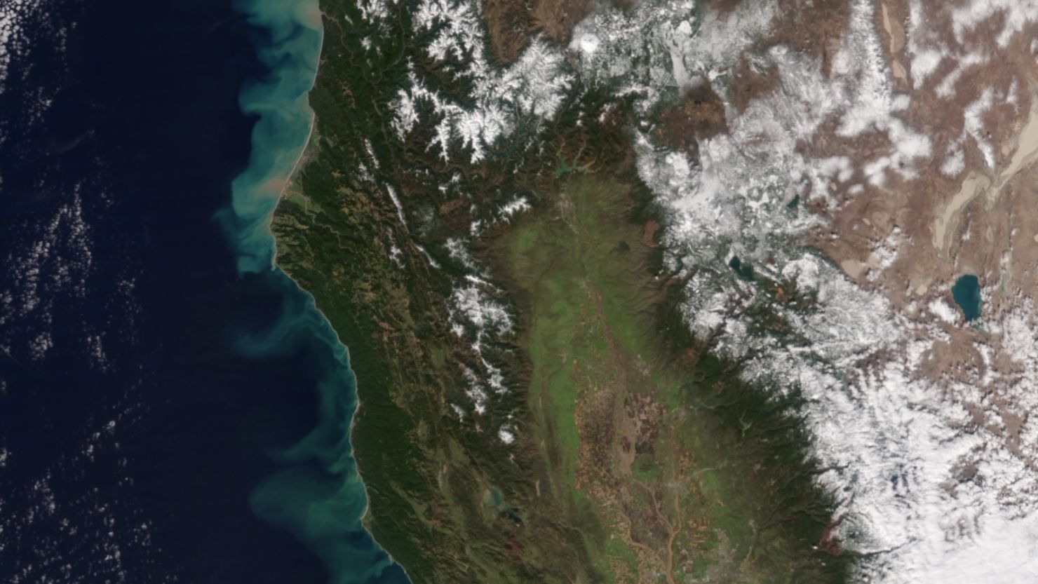 A NASA satellite photo show how California's rains have dumped sediment into the Pacific Ocean.