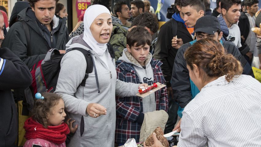 Food and drink is distributed by volunteers to refugees that arrived at Malmoe train station in Malmoe, Sweden in the morning of September 10, 2015. AFP PHOTO / TT NEWS AGENCY / OLA TORKELSSON  +++ SWEDEN OUT +++        (Photo credit should read OLA TORKELSSON/AFP/Getty Images)
