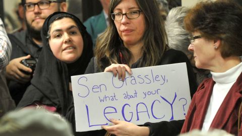 A woman holds up a sign during a U.S. Sen. Chuck Grassley (R-IA) Town Hall meeting at the Hancock County Courthouse February 21, 2017 in Garner, Iowa.